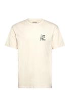 Application T-Shirt Tops T-shirts Short-sleeved Cream Revolution